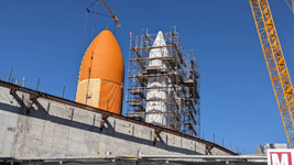 ET-94 and the twin solid rocket boosters for Endeavour stand tall at the construction site for the future Samuel Oschin Air and Space Center in Los Angeles...on January 12, 2024.