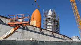 ET-94 and the twin solid rocket boosters for Endeavour stand tall at the construction site for the future Samuel Oschin Air and Space Center in Los Angeles...on January 12, 2024.