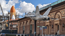 With a retired F/A-18 Hornet in the foreground, Endeavour's completed Space Shuttle Stack stands tall at the construction site for the Samuel Oschin Air and Space Center...on February 2, 2024.