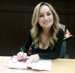 Giada De Laurentiis poses for the camera while signing my copy of her book GIADA'S ITALY