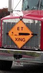 The truck that will tow ET-94 to the California Science Center bears this customized traffic sign.