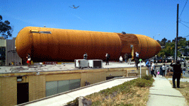 An airliner flies overhead as ET-94 rolls down Manchester Boulevard in Inglewood...on May 21, 2016.