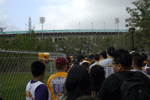 Fans wait to enter the Los Angeles Memorial Coliseum to attend the Lakers' victory rally