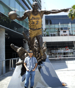 Posing in front of a statue of Magic Johnson