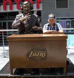 Posing next to the statue of late Lakers broadcaster Chick Hearn