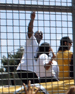 Magic Johnson waves to the crowd