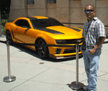 Posing in front of the Chevrolet Camaro used as Bumblebee in TRANSFORMERS: DARK OF THE MOON.
