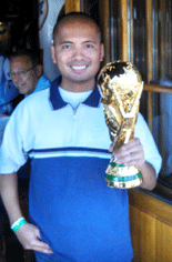 Taking another photo with the World Cup trophy replica at Legends sports bar in Long Beach.