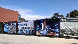 Images of the Samuel Oschin Air and Space Center adorn a fence surrounding the building's construction site...on August 9, 2022.