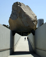 Approaching 'Levitated Mass' to take a close-up picture of it.