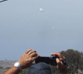 Followed by two F-18 chase planes, the Shuttle Carrier Aircraft ferrying Endeavour flies over LAX on September 21, 2012.