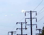 Followed by two F-18 chase planes, the Shuttle Carrier Aircraft ferrying Endeavour flies over LAX on September 21, 2012.