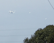 Followed by two F-18 chase planes, the Shuttle Carrier Aircraft ferrying Endeavour flies over LAX on September 21, 2012.