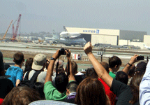 The Shuttle Carrier Aircraft carrying Endeavour heads for a United Airlines hangar at LAX on September 21, 2012.