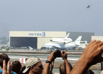 The Shuttle Carrier Aircraft carrying Endeavour heads for a United Airlines hangar at LAX on September 21, 2012.