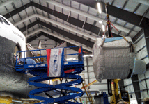 The SPACEHAB module is lifted into the air during the 'Go for Payload' event at the California Science Center, on October 9, 2014.