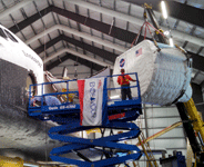 The SPACEHAB module is lifted into the air during the 'Go for Payload' event at the California Science Center, on October 9, 2014.