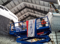 The SPACEHAB module is lifted into the air during the 'Go for Payload' event at the California Science Center, on October 9, 2014.