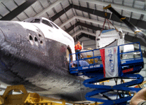 The SPACEHAB module is lifted into the air during the 'Go for Payload' event at the California Science Center, on October 9, 2014.