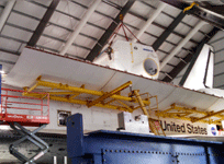 The SPACEHAB module is about to be placed inside Endeavour's cargo bay during the 'Go for Payload' event at the California Science Center, on October 9, 2014.