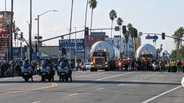A Los Angeles Police Department (LAPD) detail prepares to escort Endeavour's two solid rocket motors down Figueroa Street to the California Science Center in Exposition Park...on October 11, 2023.