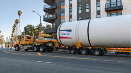 The truck towing the first of Endeavour's two solid rocket motors drives down Figueroa Street to the California Science Center in Exposition Park...on October 11, 2023.