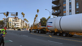 The truck towing the first of Endeavour's two solid rocket motors drives down Figueroa Street to the California Science Center in Exposition Park...on October 11, 2023.