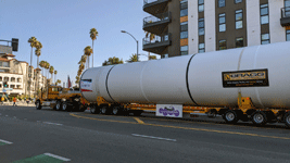 The truck towing the first of Endeavour's two solid rocket motors drives down Figueroa Street to the California Science Center in Exposition Park...on October 11, 2023.