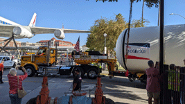 The truck towing the first of Endeavour's two solid rocket motors enters the premises at Exposition Park in Los Angeles...on October 11, 2023.