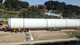 The first of Endeavour's two solid rocket motors is about to be lifted and placed onto a temporary workstand near the Rose Garden at Exposition Park in Los Angeles...on October 11, 2023.