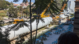 The second of Endeavour's two solid rocket motors is placed onto a temporary workstand near the Rose Garden at Exposition Park in Los Angeles...on October 11, 2023.