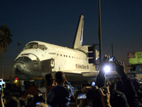 Space shuttle Endeavour prepares to cross the 405 Freeway in Inglewood, on October 12, 2012.