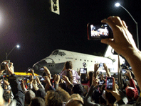 Space shuttle Endeavour is about to cross the 405 Freeway in Inglewood, on October 12, 2012.