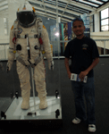 Posing with the pressure suit worn by Felix Baumgartner during his historic space jump on October 14, 2012.