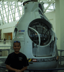 Posing with the Red Bull Stratos capsule at the California Science Center, on October 13, 2013.