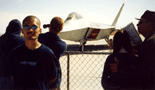 Posing in front of an F-22 Raptor at an Edwards Air Force Base air show.