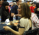 Alyssa Milano signs autographs at the Comikaze Expo in the Los Angeles Convention Center, on November 2, 2013.