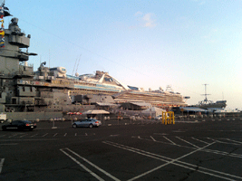 A cruise ship sails past the USS Iowa on its way out to sea, on November 4, 2013.