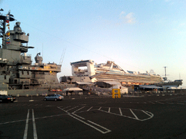 A cruise ship sails past the USS Iowa on its way out to sea, on November 4, 2013.