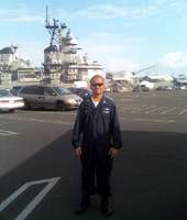 Posing in front of the USS Iowa at the Pacific Battleship Center in San Pedro, California, on November 4, 2013.
