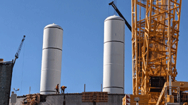 The twin solid rocket motors for Endeavour stand tall at the construction site for the future Samuel Oschin Air and Space Center in Los Angeles...on November 8, 2023.