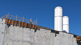 The twin solid rocket motors for Endeavour stand tall at the construction site for the future Samuel Oschin Air and Space Center in Los Angeles...on November 8, 2023.