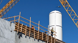 The twin solid rocket motors for Endeavour stand tall at the construction site for the future Samuel Oschin Air and Space Center in Los Angeles...on November 8, 2023.