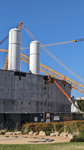 The twin solid rocket motors for Endeavour stand tall at the construction site for the future Samuel Oschin Air and Space Center in Los Angeles...on November 8, 2023.