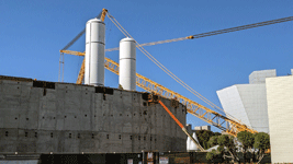 The twin solid rocket motors for Endeavour stand tall at the construction site for the future Samuel Oschin Air and Space Center in Los Angeles...on November 8, 2023.