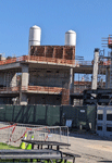 The twin solid rocket motors for Endeavour stand tall at the construction site for the future Samuel Oschin Air and Space Center in Los Angeles...on November 8, 2023.