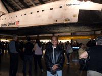 Posing with space shuttle Endeavour inside the Samuel Oschin Pavilion at the California Science Center, on November 16, 2012.
