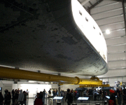 Space shuttle Endeavour dwarfs the crowd walking beneath her inside the Samuel Oschin Pavilion, on November 16, 2012.