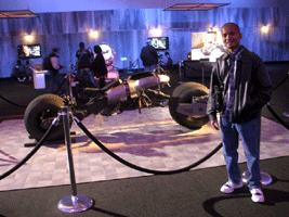 Posing with the Batpod from THE DARK KNIGHT and THE DARK KNIGHT RISES, on December 7, 2012.