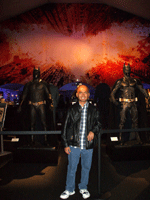 Posing with the Batsuits of THE DARK KNIGHT Trilogy, on December 7, 2012.